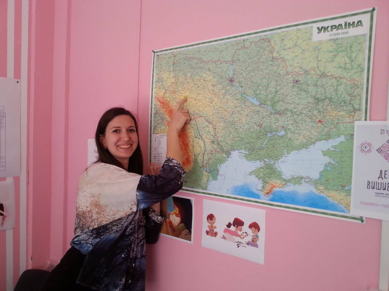 Photo of Oksana in front of a map of Ukraine